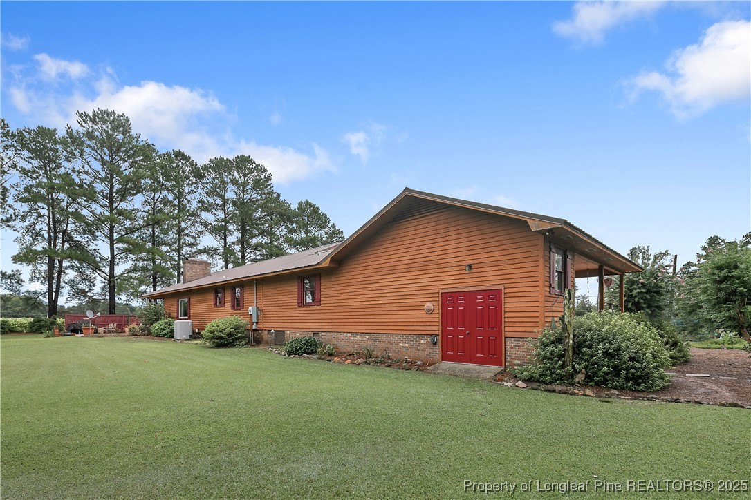 5017 Goldsboro Road Wade, NC 28395 - Photo 44 of 50 a front view of house with yard and trees