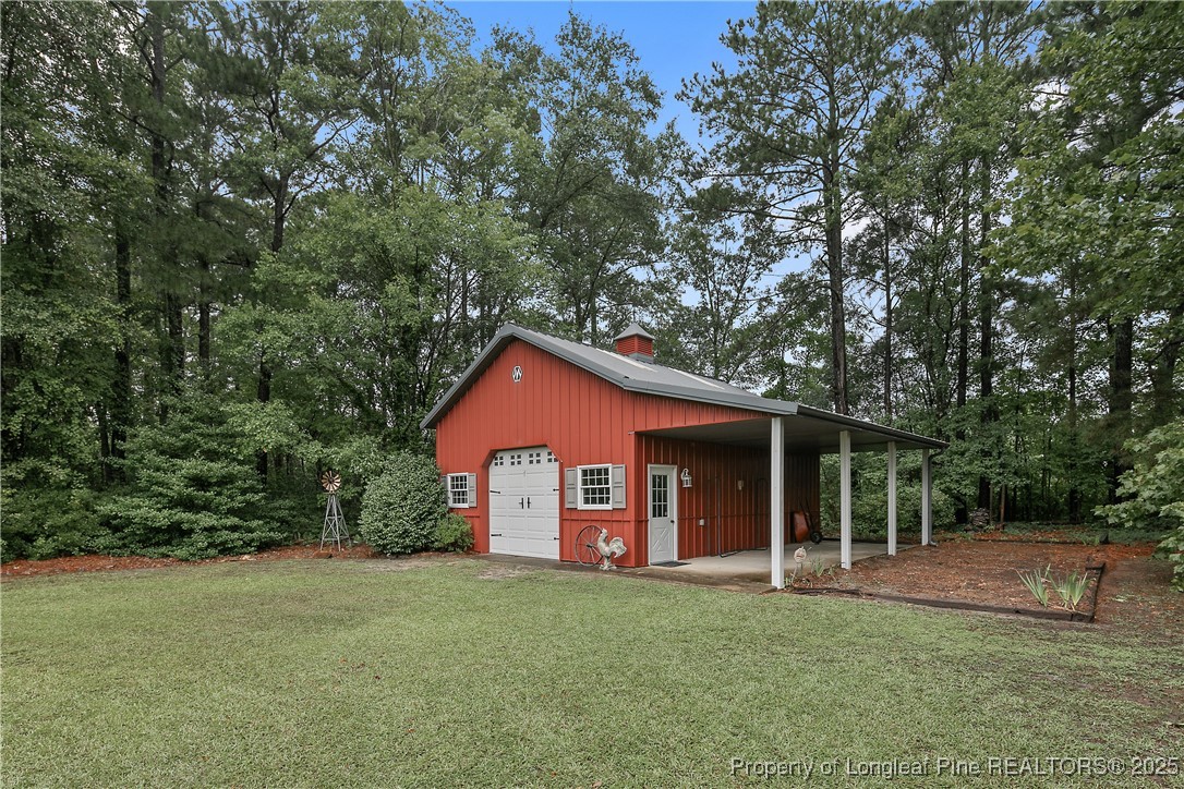 5017 Goldsboro Road Wade, NC 28395 - Photo 49 of 50 a view of a house with a backyard