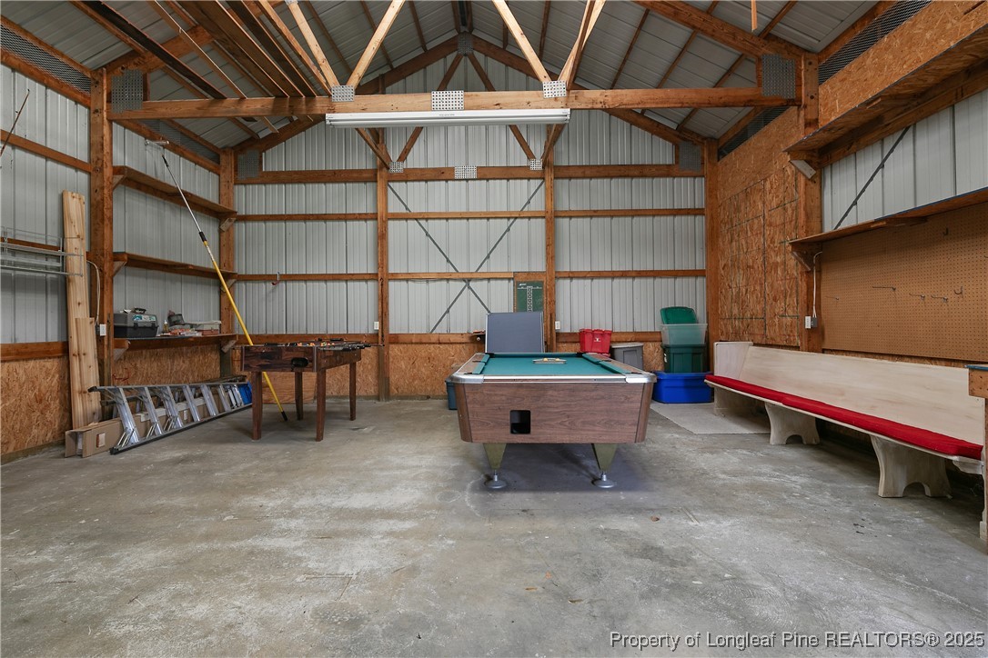 5017 Goldsboro Road Wade, NC 28395 - Photo 50 of 50 a backyard of a house with barbeque oven table and chairs