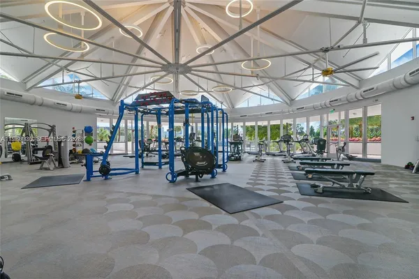 a view of patio with chairs and table under an umbrella
