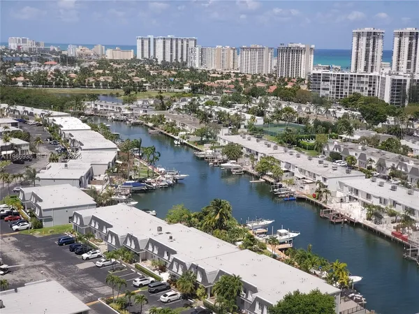 an aerial view of a city with lake view