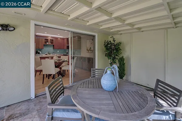 a view of a livingroom with furniture and a potted plant