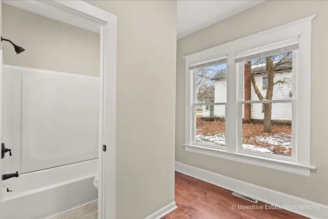 a view of an empty room with a window