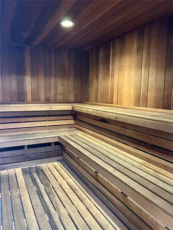 a kitchen with stainless steel appliances kitchen island granite countertop a sink and a stove top oven