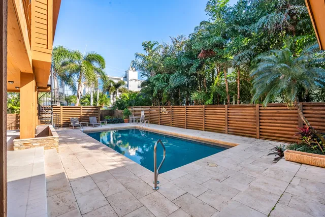 a view of a swimming pool with a lounge chairs