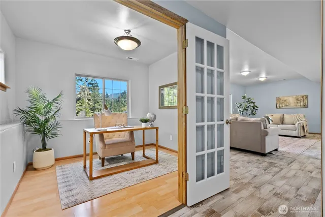a living room with furniture and a potted plant