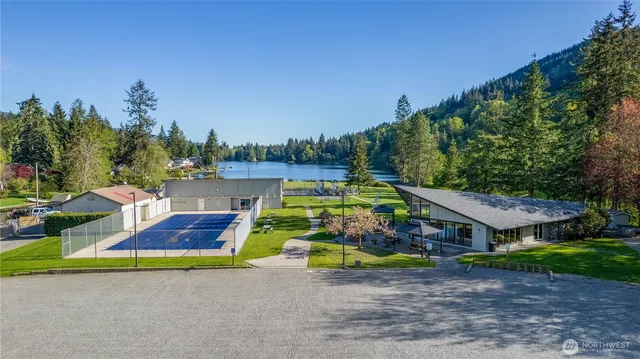 an aerial view of a house with garden space and street view
