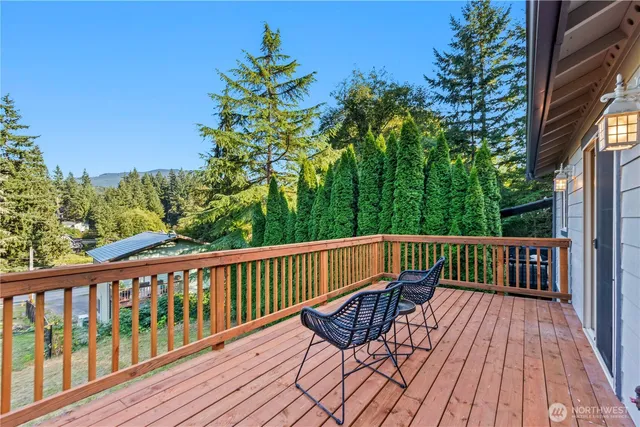 a view of a wooden deck with a yard