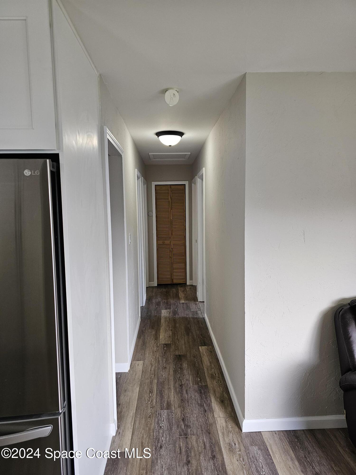 2116 Warwick Road Melbourne, FL 32935 - Photo 7 of 19 Hall to beds/bath