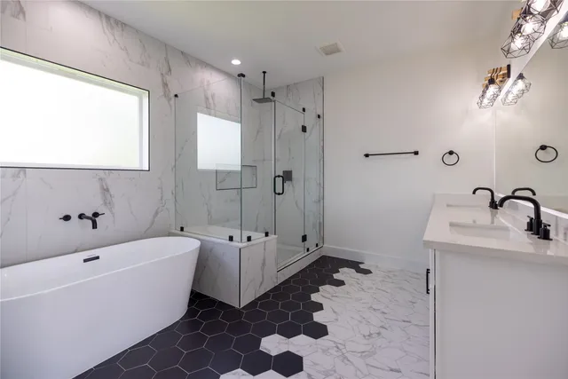 a bathroom with a bathtub and a sink