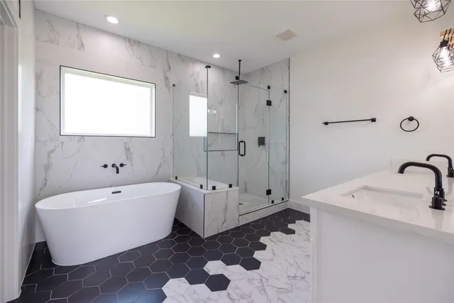 a white bath tub sitting next to a white sink