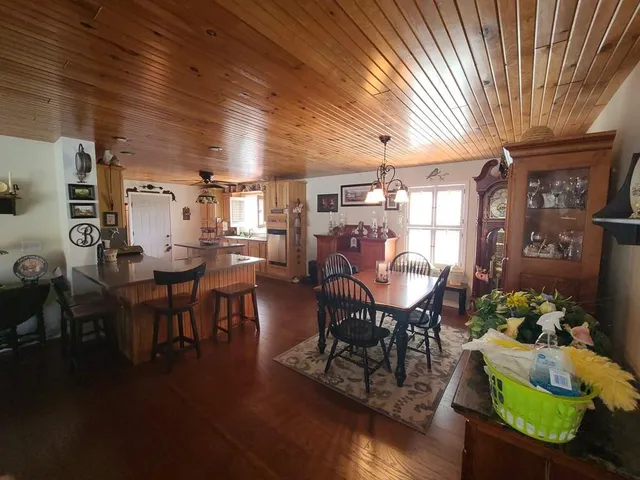 a bedroom with furniture and wooden floor