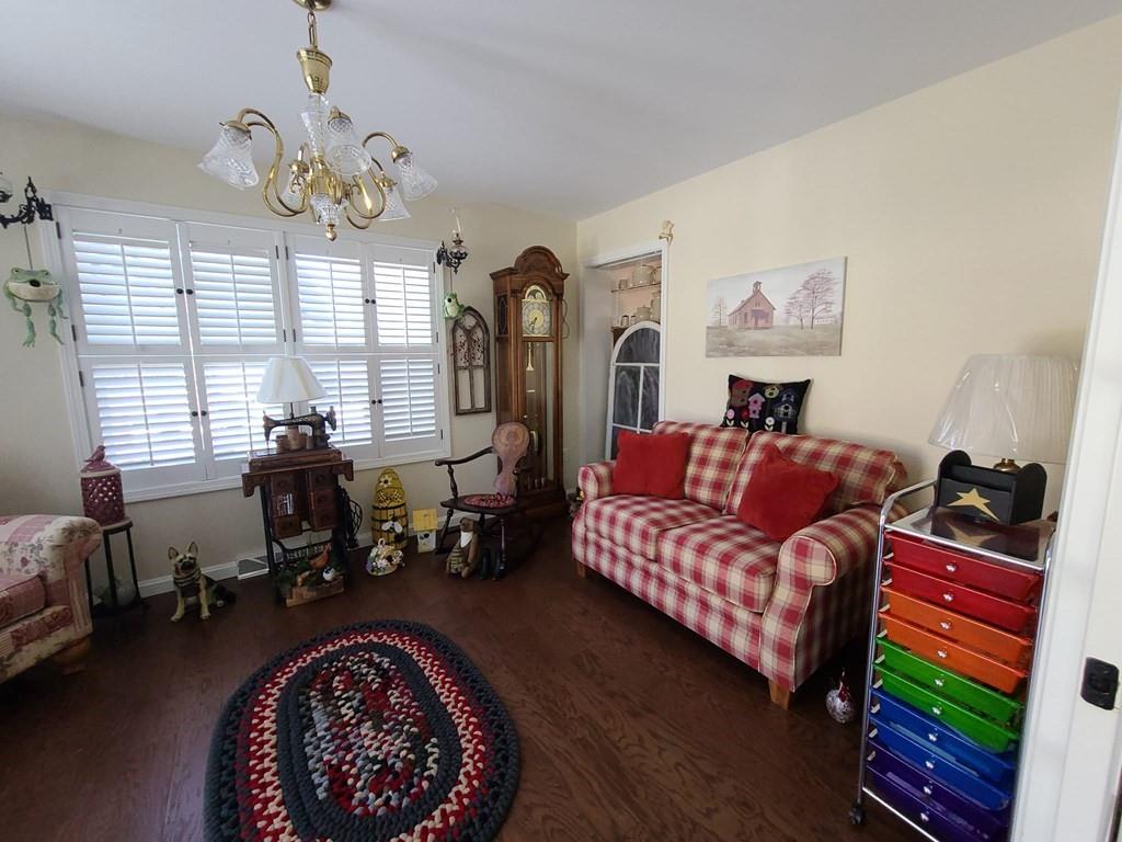 1101 Tin Town Road Sligo, PA 16255 - Photo 24 of 41 a living room with furniture and a chandelier