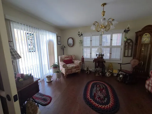 a view of a livingroom with furniture and wooden floor