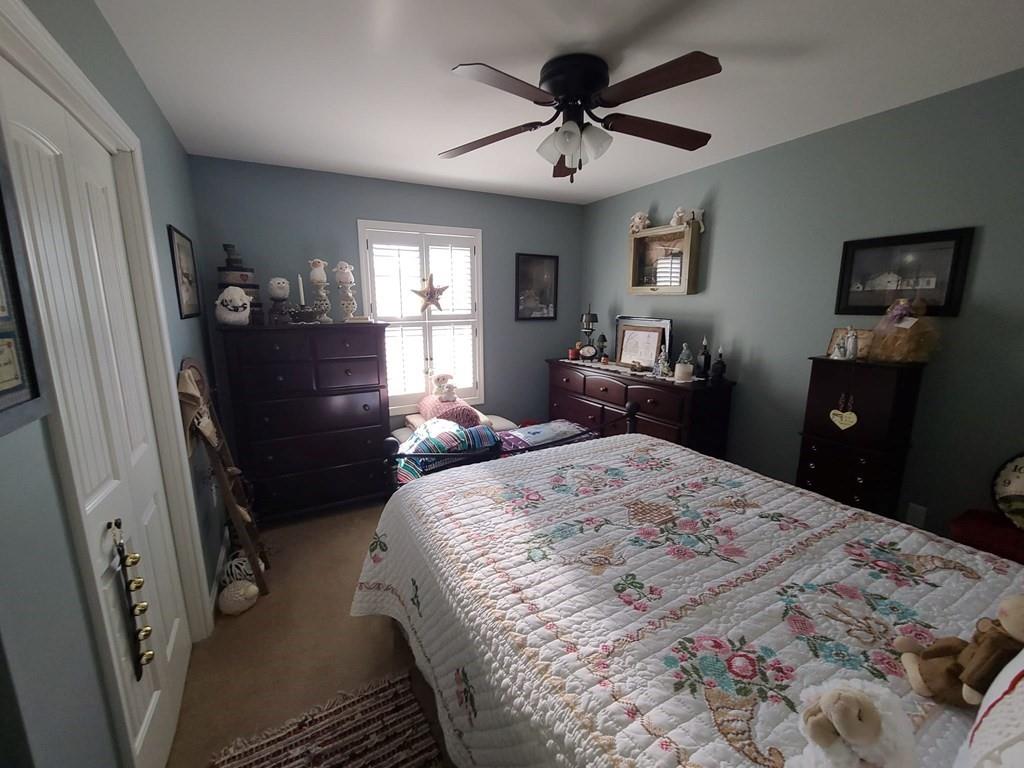 1101 Tin Town Road Sligo, PA 16255 - Photo 31 of 41 a bedroom with a bed and wooden floor