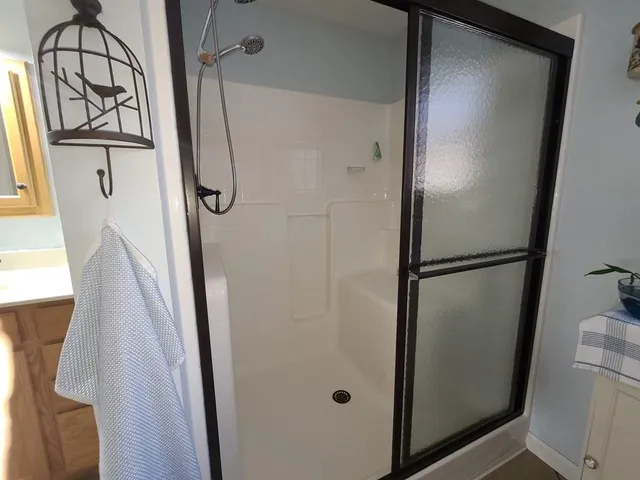 a bathroom with a sink toilet and window
