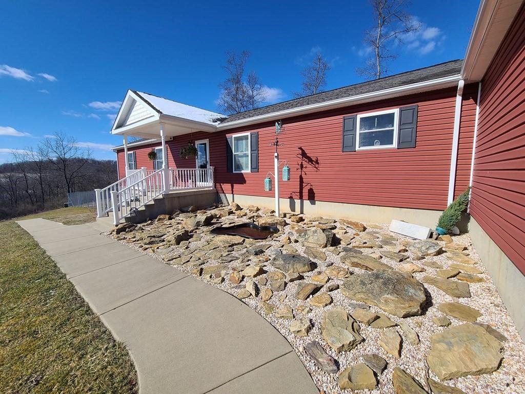 1101 Tin Town Road Sligo, PA 16255 - Photo 5 of 41 a front view of a house with a yard