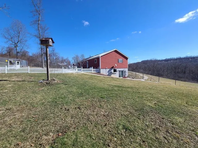 a house view with a big yard