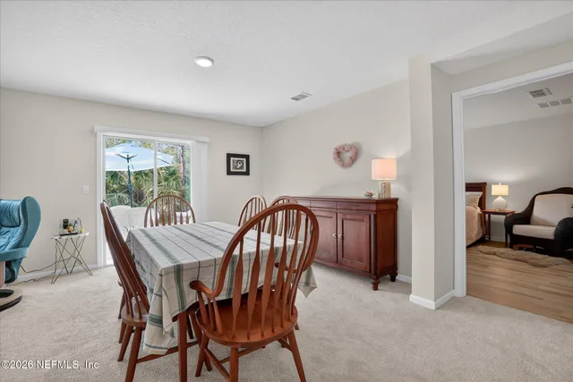 a bedroom with bed and a large window