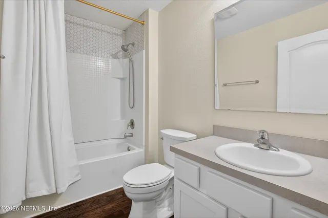 a front view of a house with garden and porch