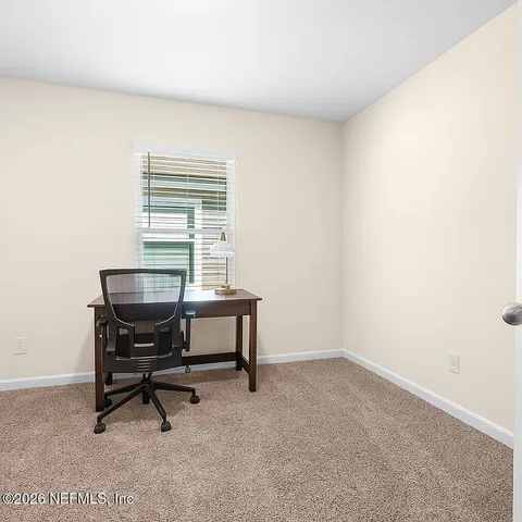 a view of an outdoor space and basketball court