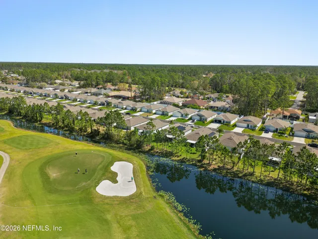 a view of a lake with a yard