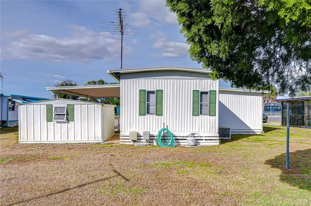 a view of a house with a yard and garage