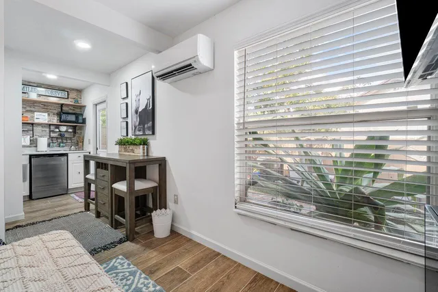 a kitchen with granite countertop a refrigerator and a sink