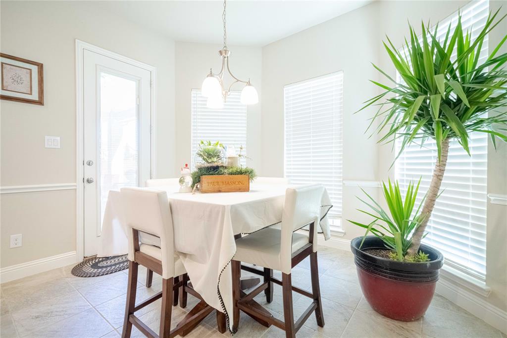 2630 Flat Bush Avenue Midlothian, TX 76065 - Photo 12 of 32 a view of a dining room with furniture window and wooden floor