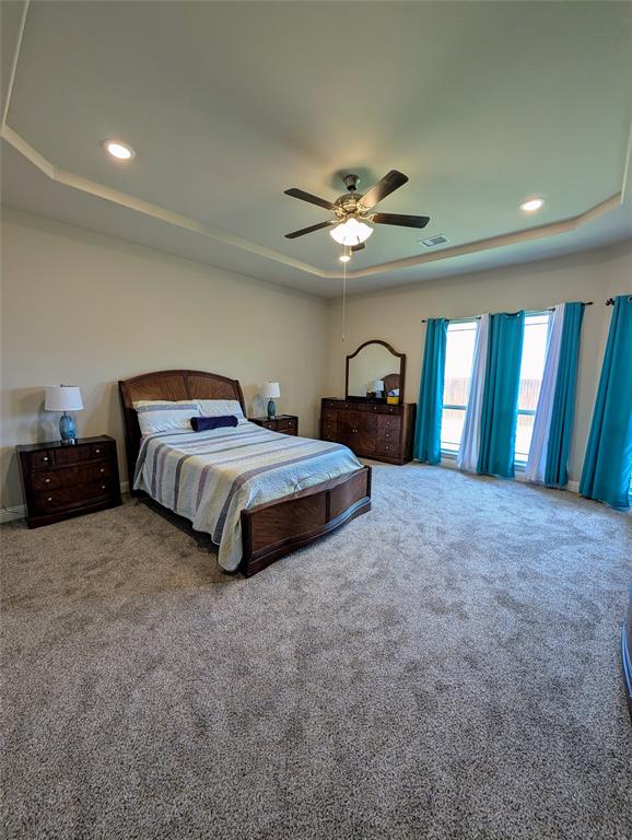 2630 Flat Bush Avenue Midlothian, TX 76065 - Photo 13 of 32 a spacious bedroom with a bed and a chandelier