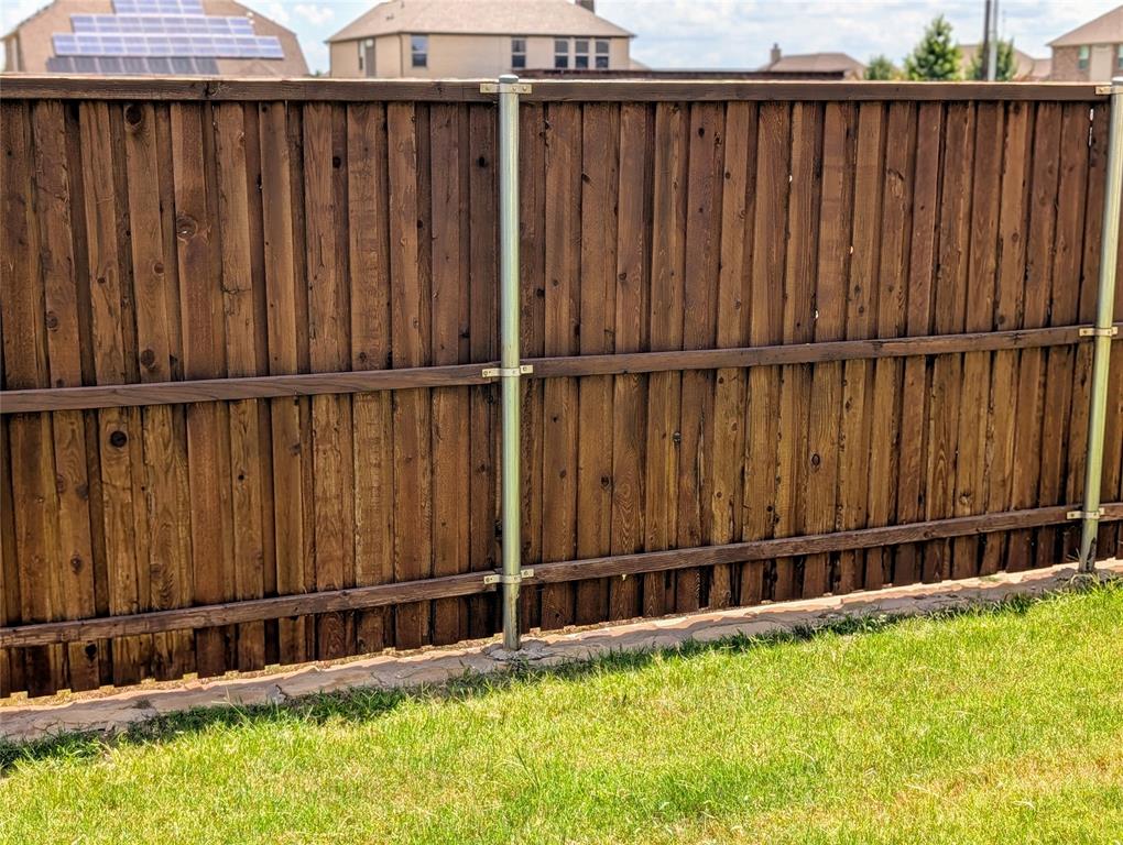 2630 Flat Bush Avenue Midlothian, TX 76065 - Photo 27 of 32 a view of a backyard with a wooden fence