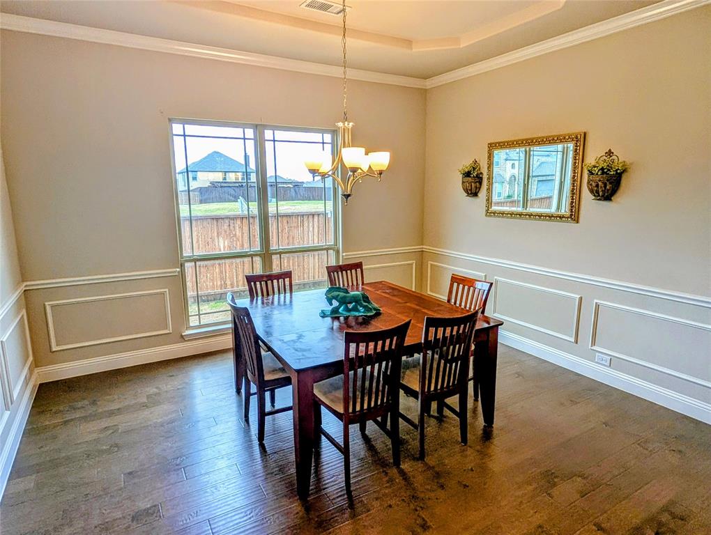 2630 Flat Bush Avenue Midlothian, TX 76065 - Photo 6 of 32 a view of a dining room with furniture window and wooden floor