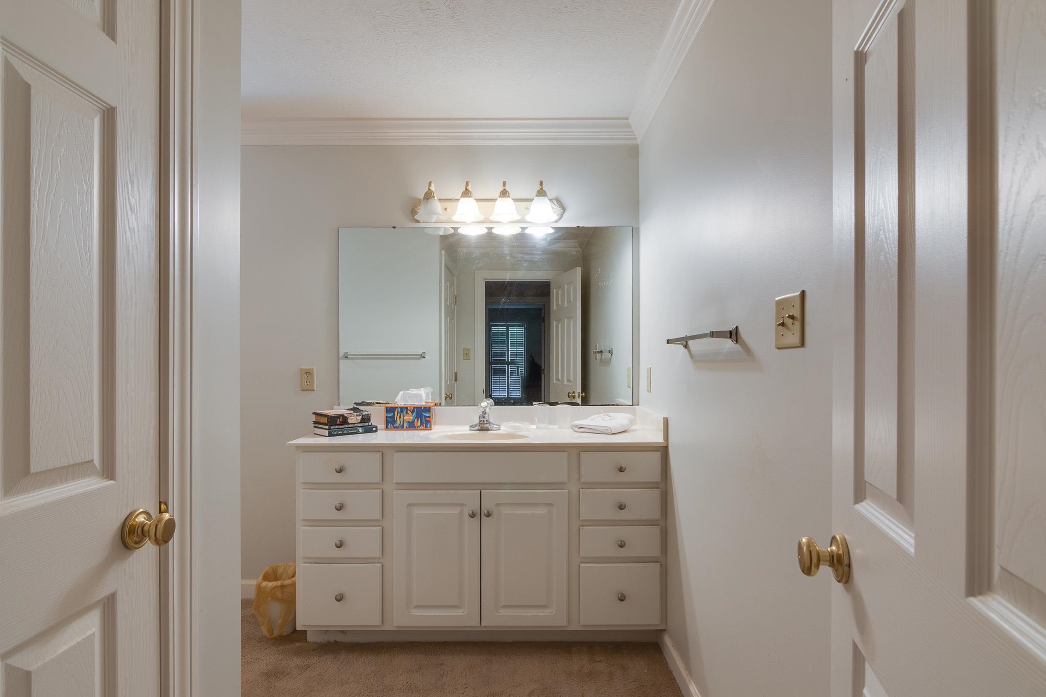 9102 Highway 76 Stanton, TN 38069 - Photo 18 of 27 Bathroom with vanity and ornamental molding