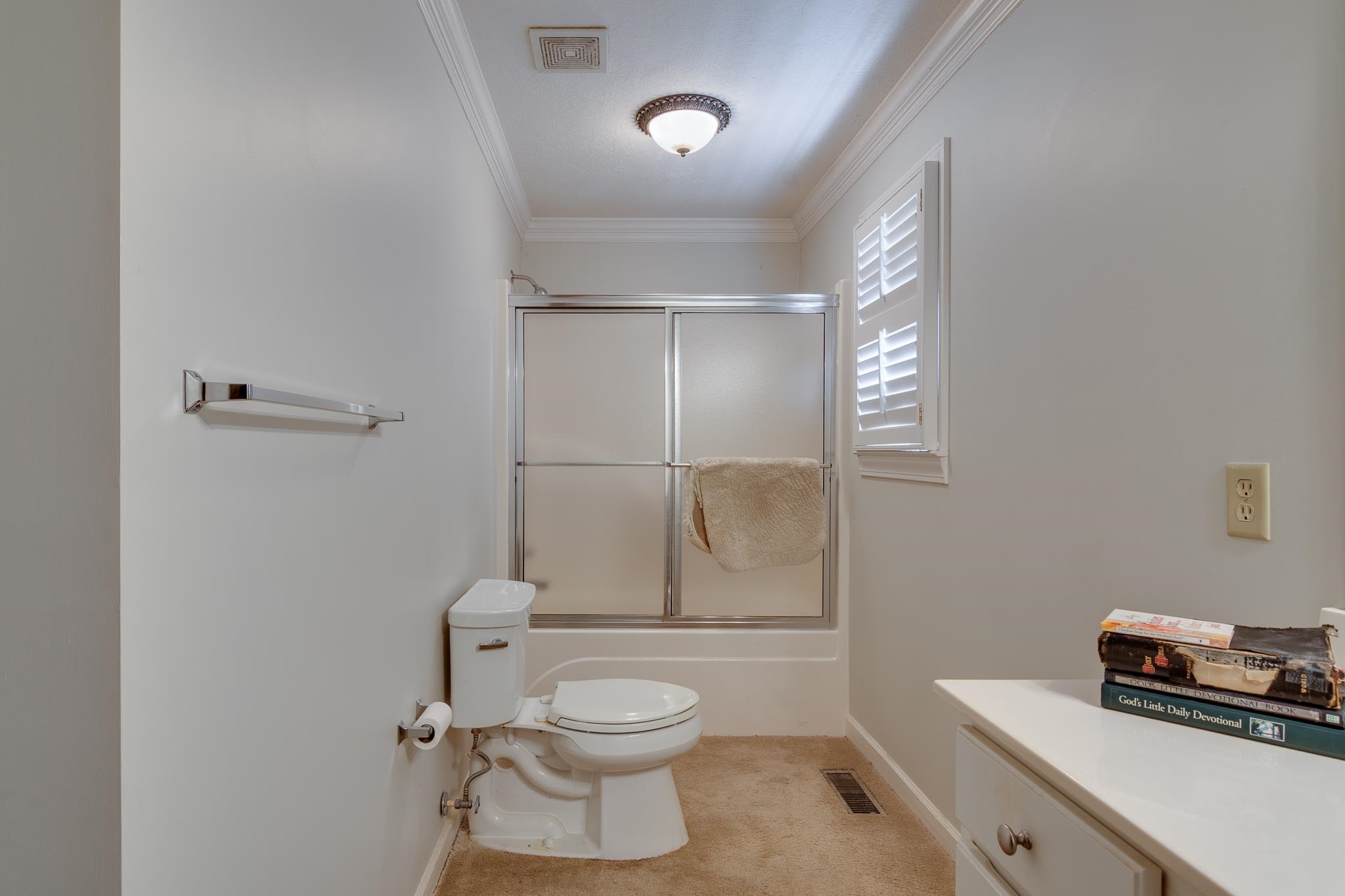 9102 Highway 76 Stanton, TN 38069 - Photo 19 of 27 Bathroom featuring crown molding, shower / bath combination with glass door, and vanity