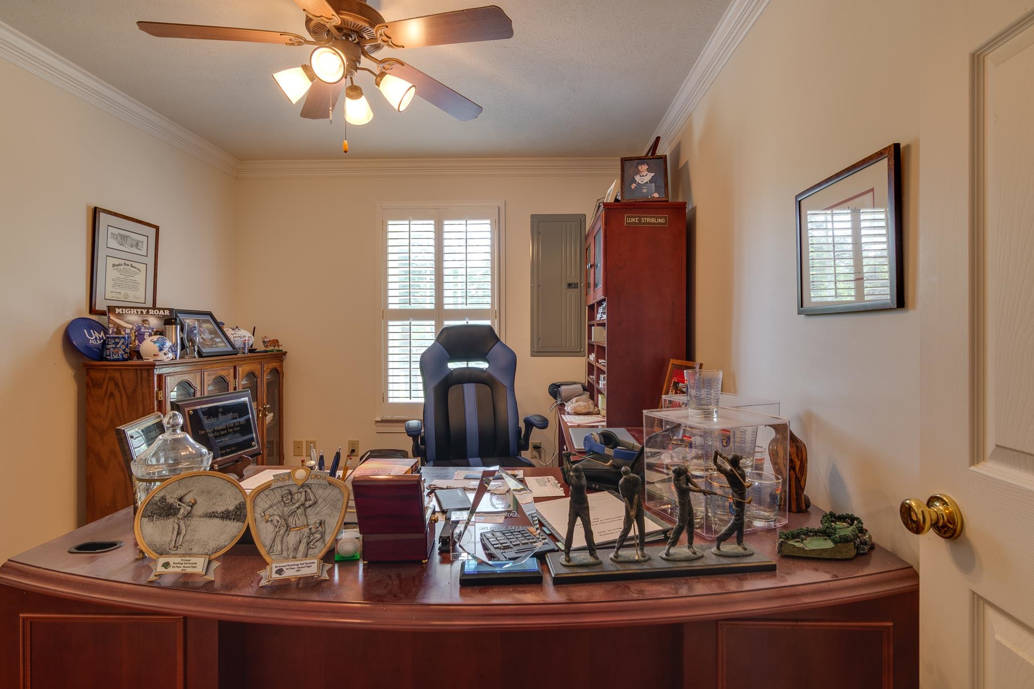 9102 Highway 76 Stanton, TN 38069 - Photo 23 of 27 Home office with crown molding, a ceiling fan, and electric panel