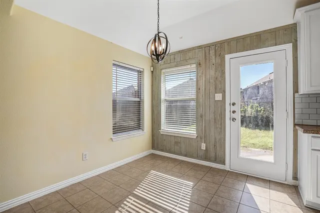 a view of an empty room with windows