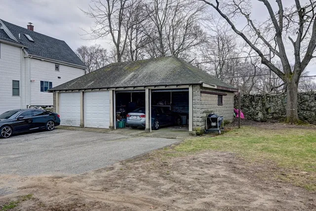 a view of a house with a yard and garage