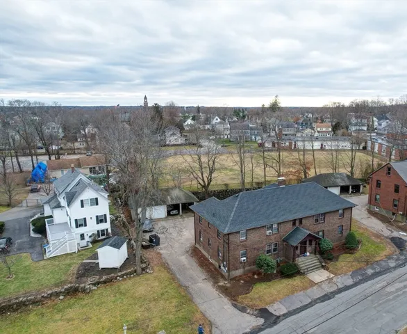 a view of a lake with a house in the background