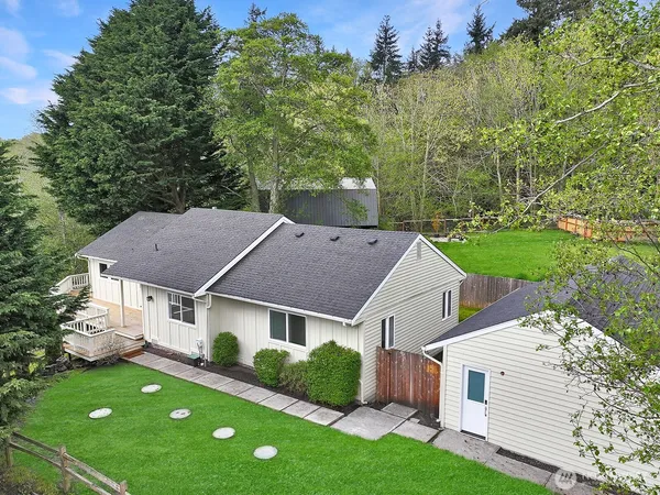 a aerial view of a house with a yard and a garden
