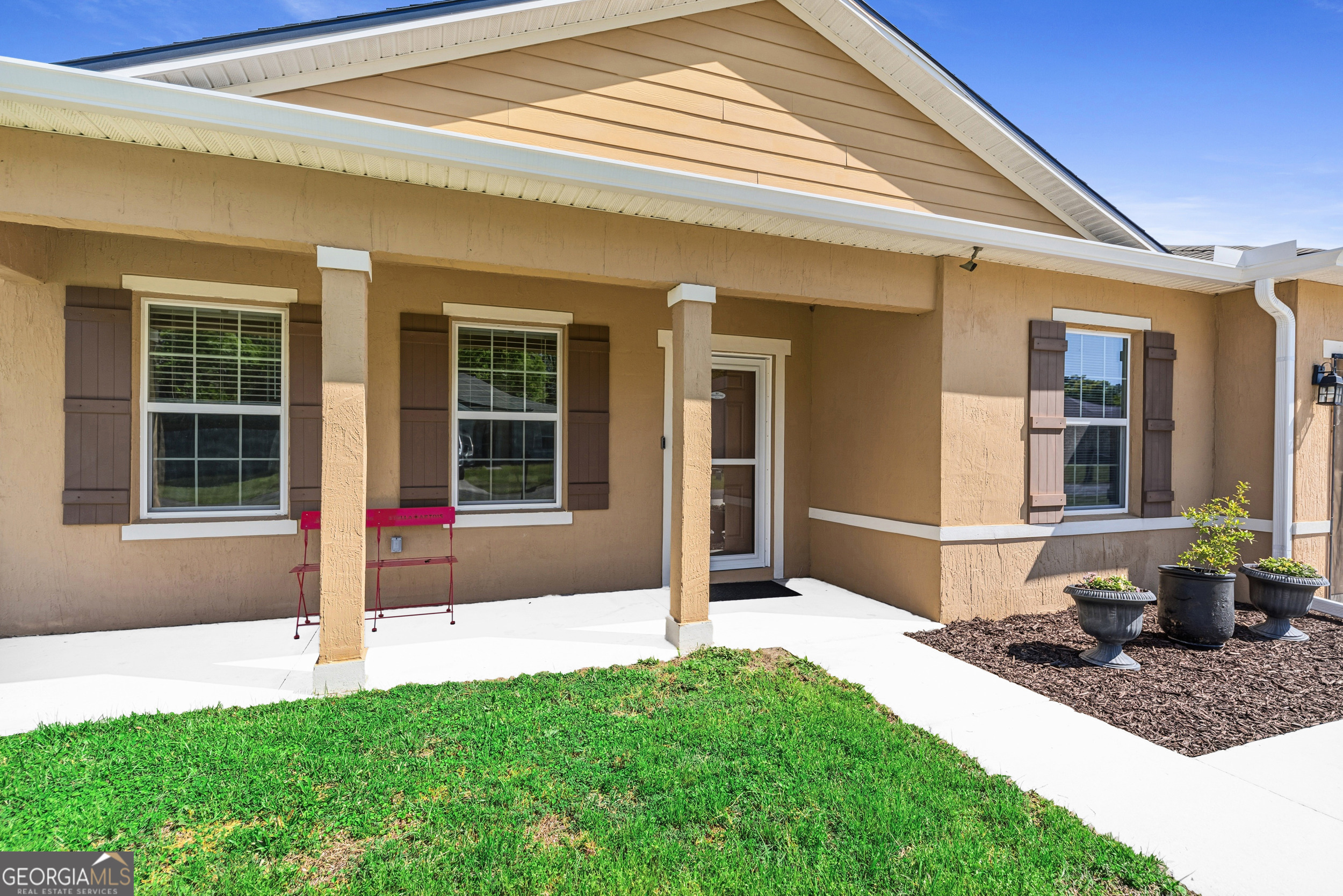 135 Walnut Way Kingsland, GA 31548 - Photo 11 of 35 a front view of a house with a yard