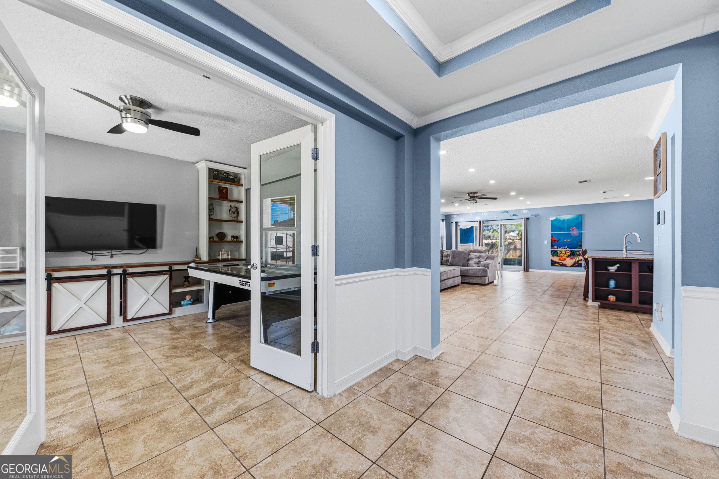 135 Walnut Way Kingsland, GA 31548 - Photo 13 of 35 a living room with furniture and a flat screen tv