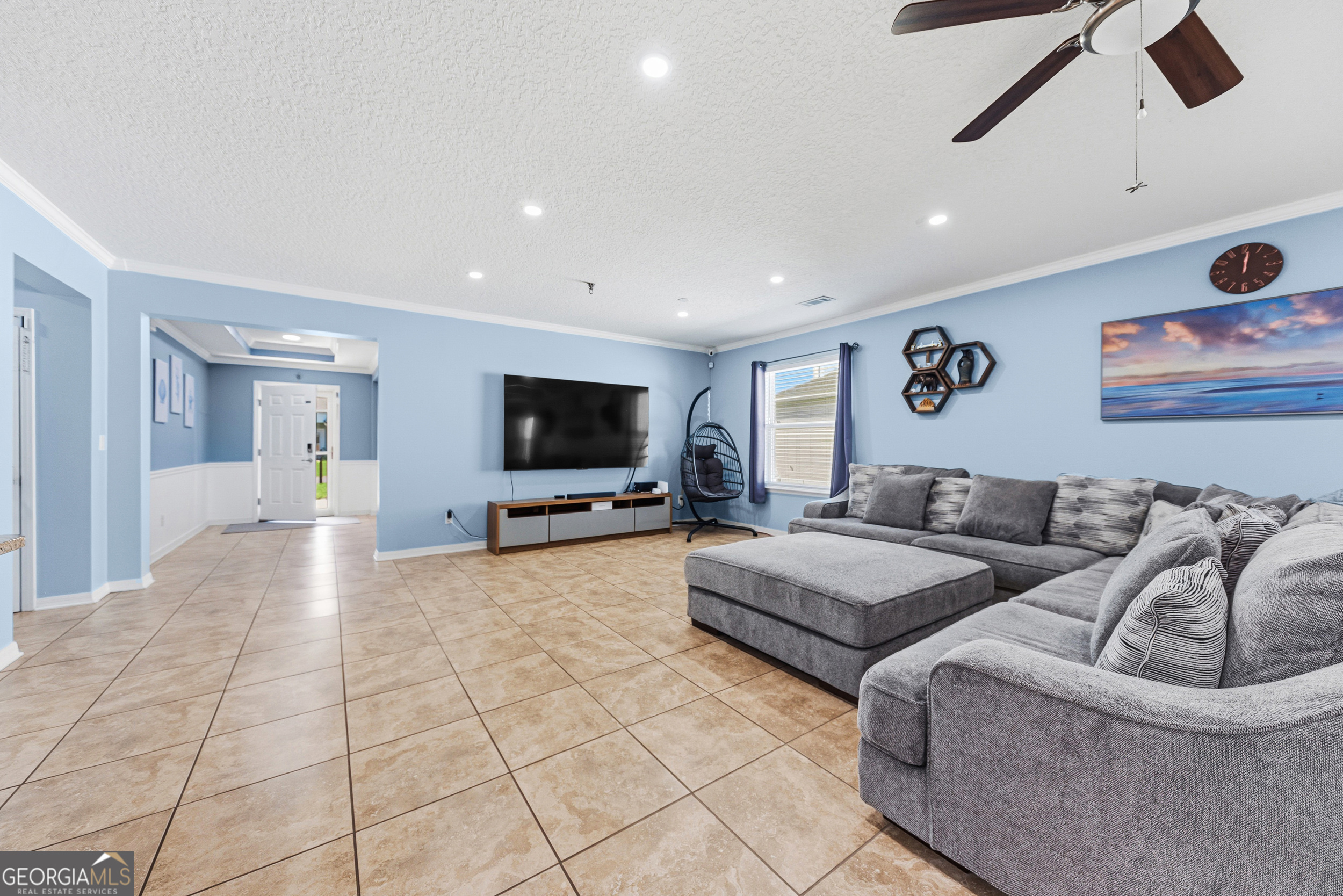 135 Walnut Way Kingsland, GA 31548 - Photo 14 of 35 a living room with furniture and a flat screen tv