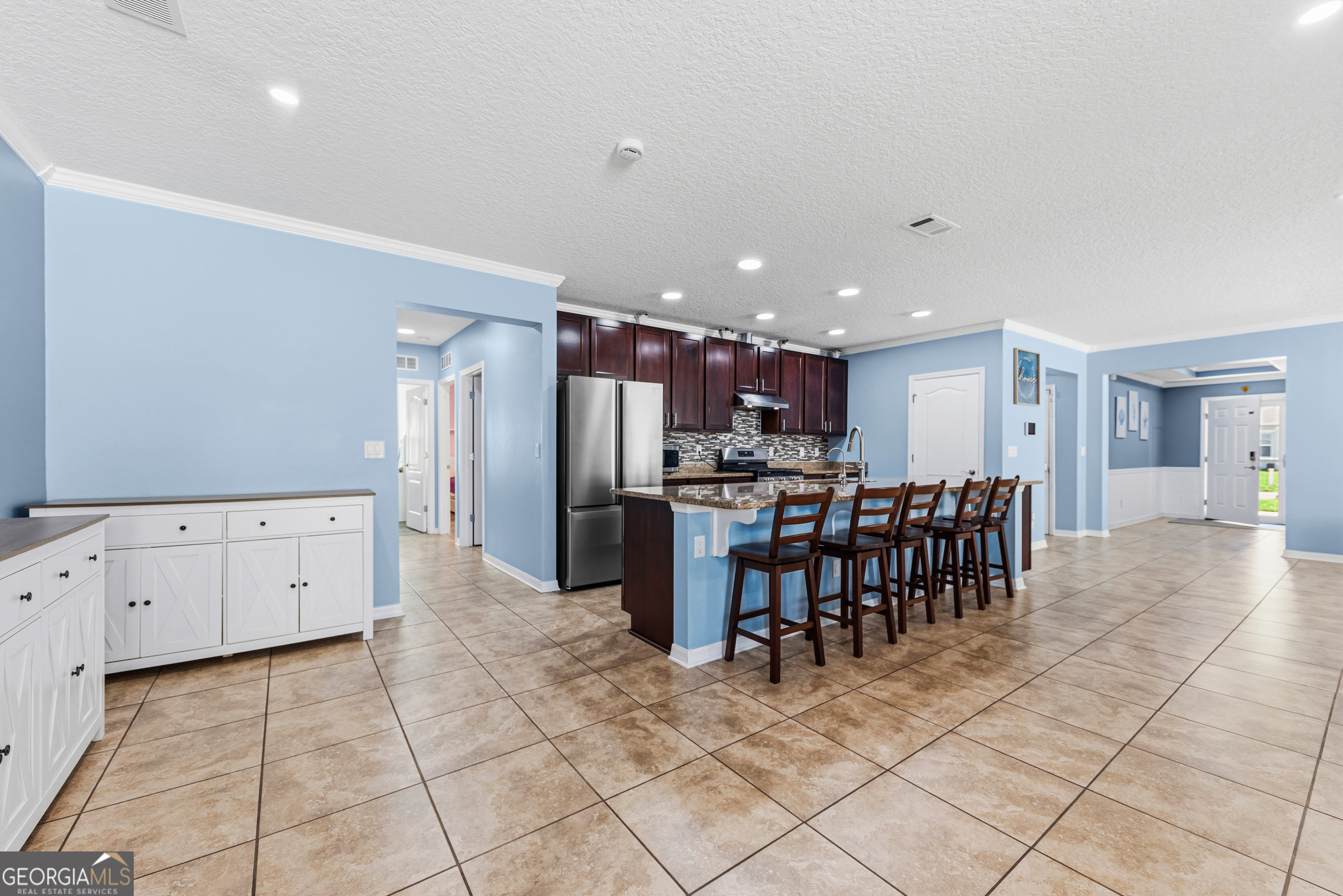 135 Walnut Way Kingsland, GA 31548 - Photo 15 of 35 a kitchen with stainless steel appliances a refrigerator and a cabinets