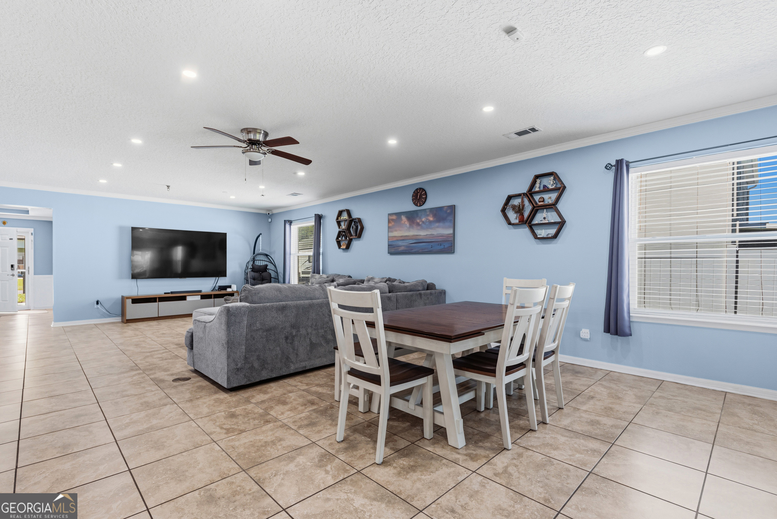 135 Walnut Way Kingsland, GA 31548 - Photo 17 of 35 a view of a livingroom with furniture and a flat screen tv