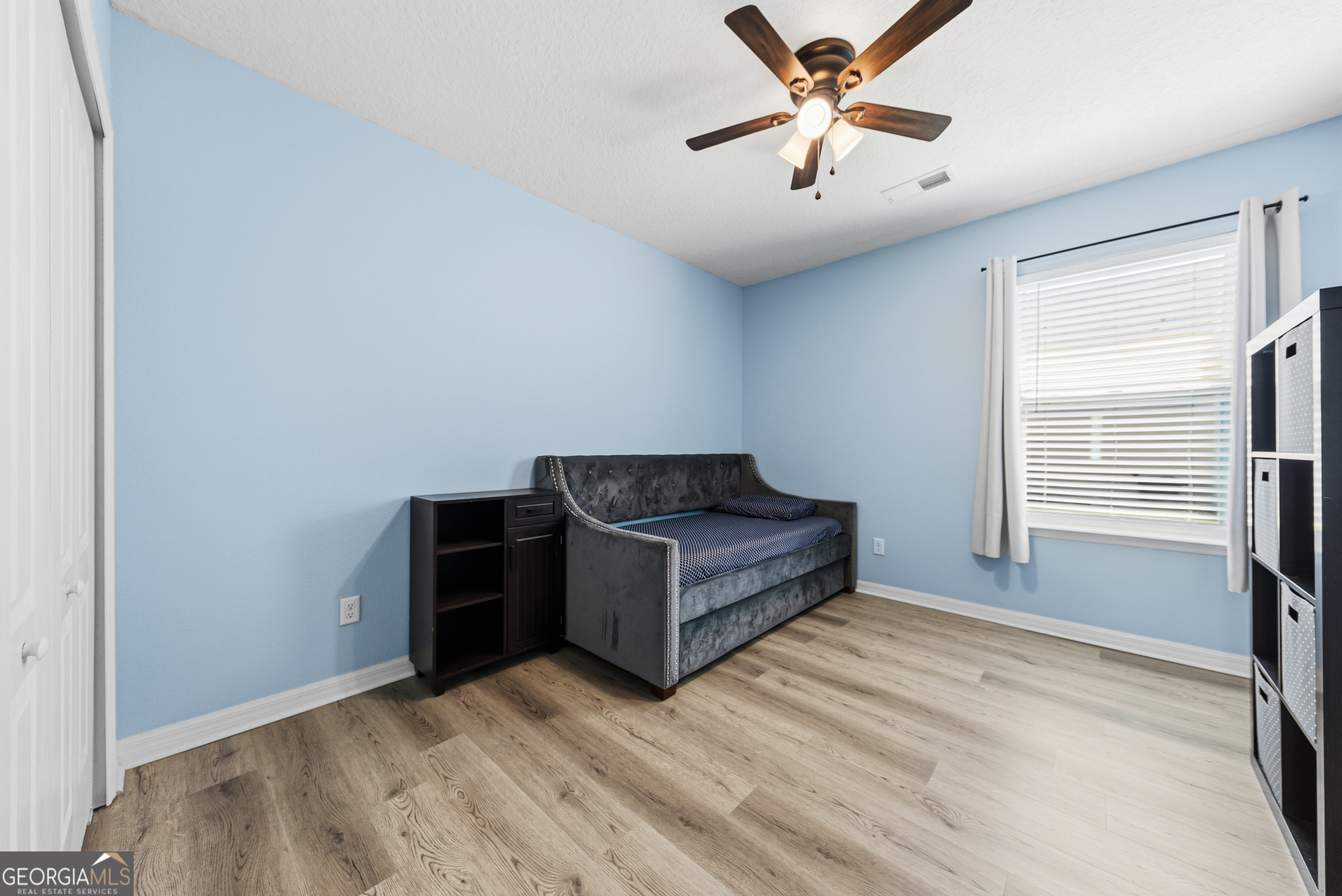 135 Walnut Way Kingsland, GA 31548 - Photo 24 of 35 a living room with furniture and a window