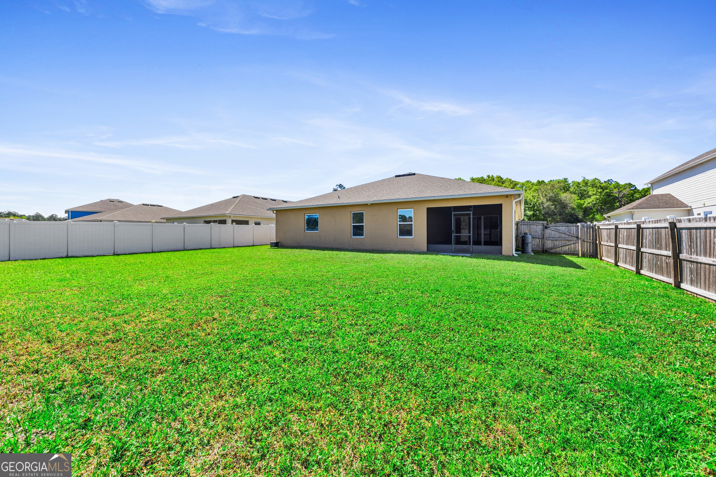 135 Walnut Way Kingsland, GA 31548 - Photo 30 of 35 a view of house with a garden