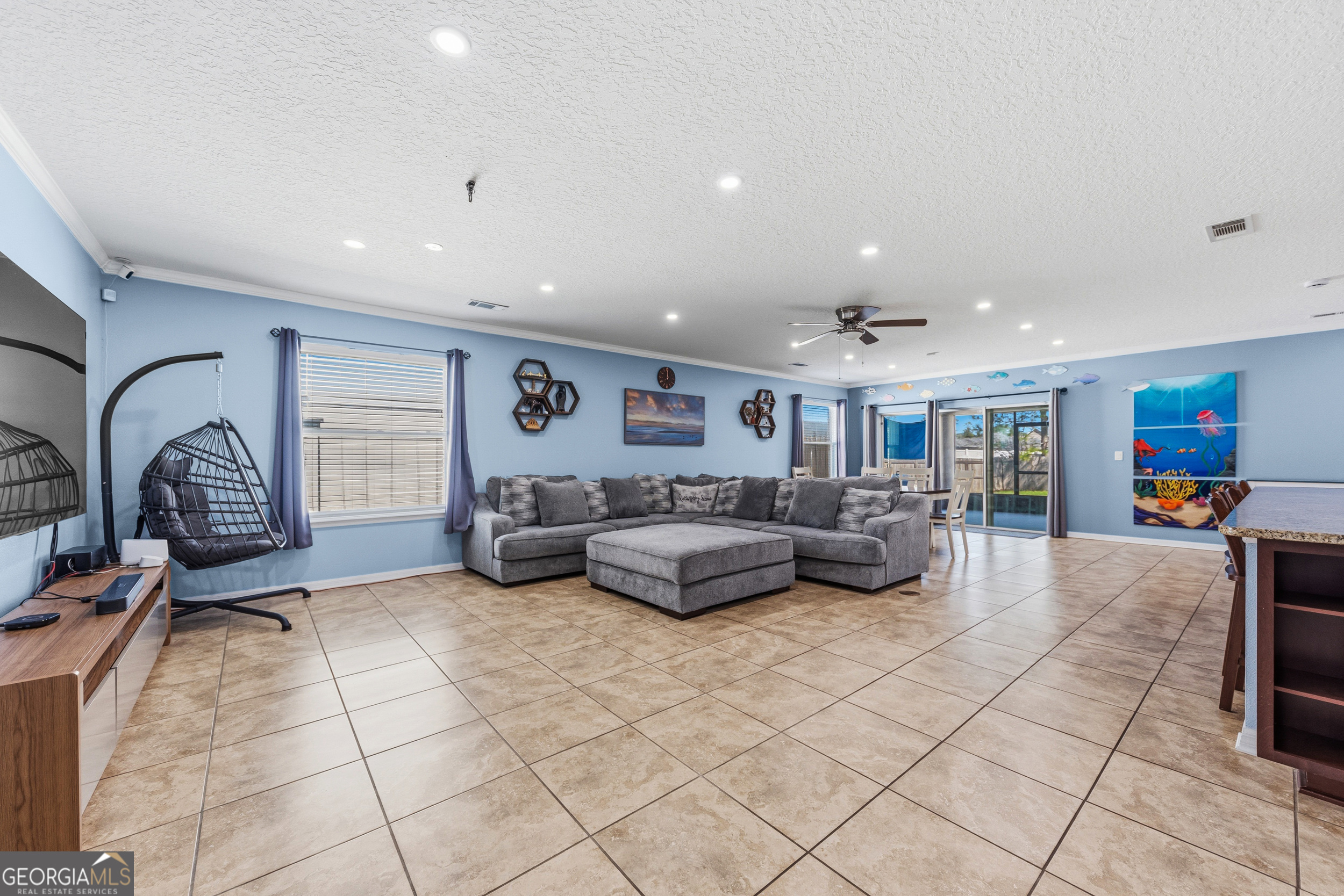 135 Walnut Way Kingsland, GA 31548 - Photo 3 of 35 a living room with furniture and a flat screen tv