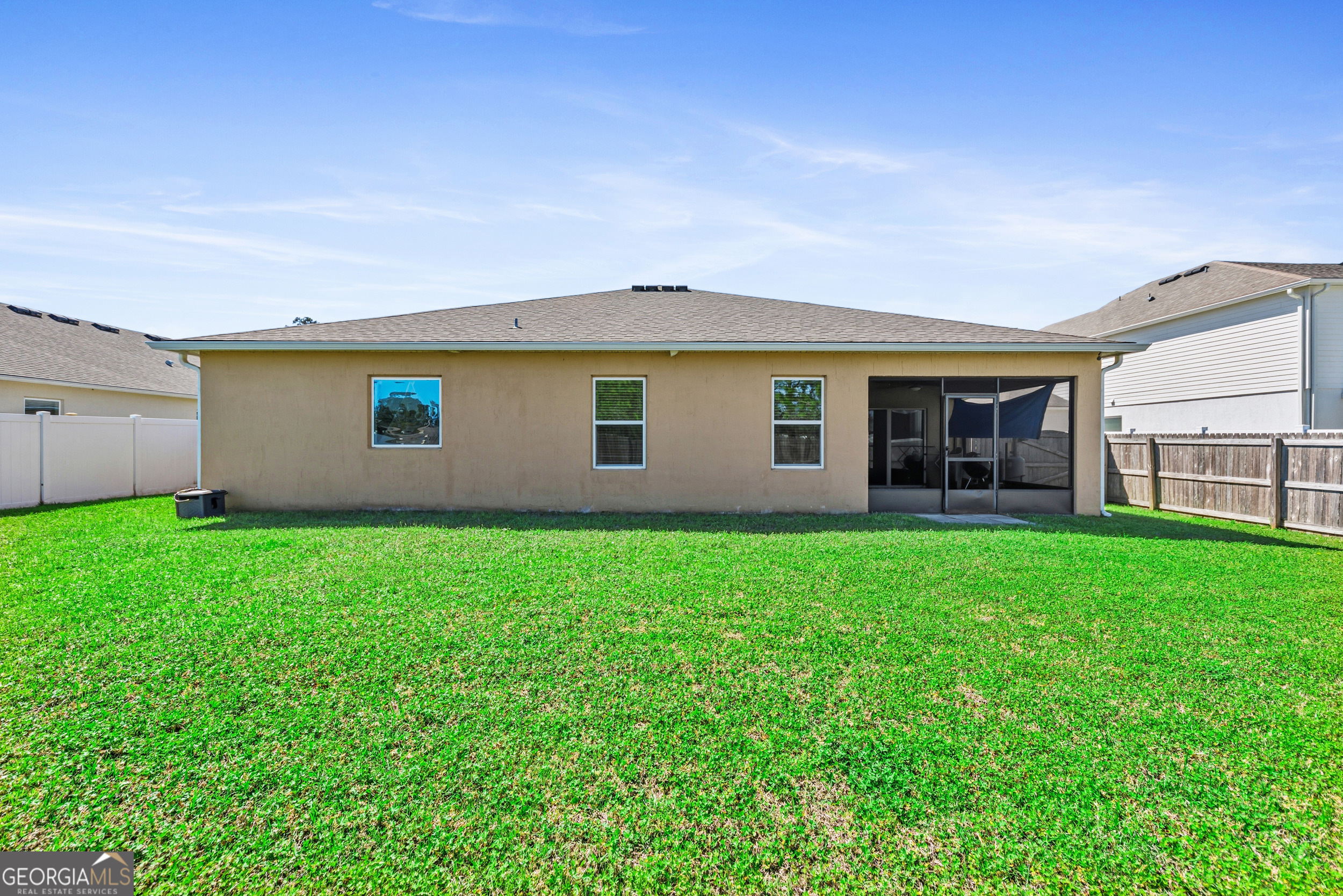135 Walnut Way Kingsland, GA 31548 - Photo 31 of 35 a front view of house with yard and green space