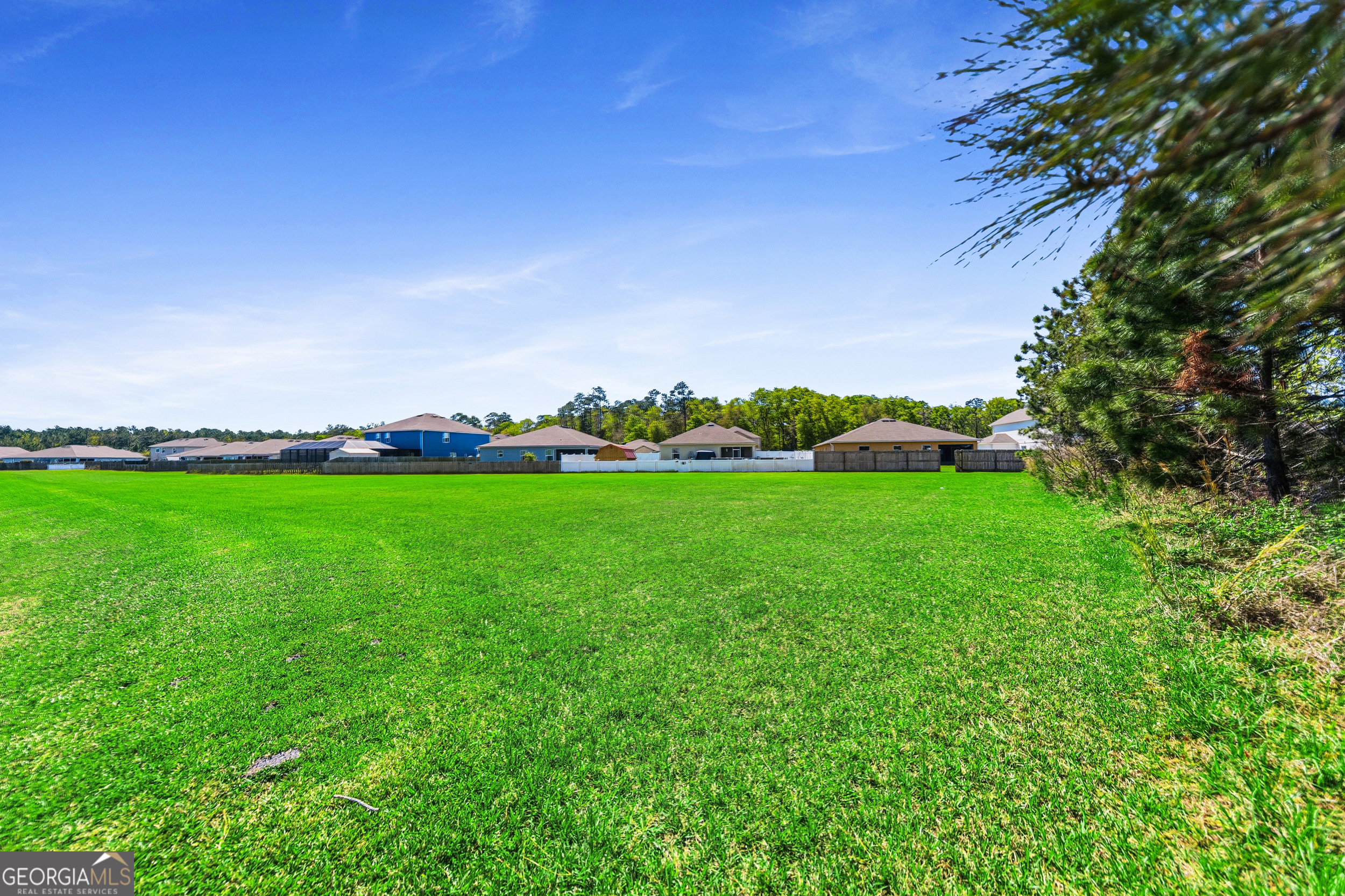 135 Walnut Way Kingsland, GA 31548 - Photo 34 of 35 a view of yard with grass & house in the background