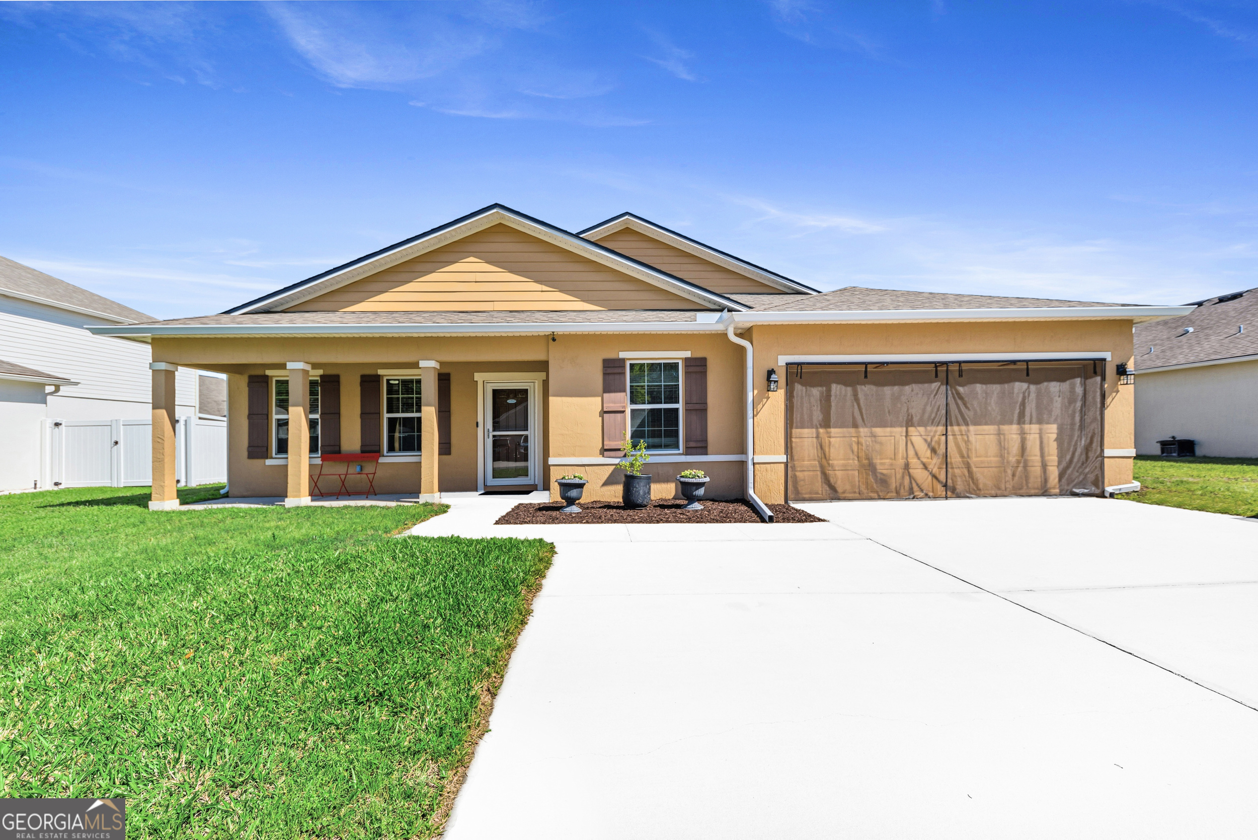 135 Walnut Way Kingsland, GA 31548 - Photo 10 of 35 a view of a house with backyard porch and garden